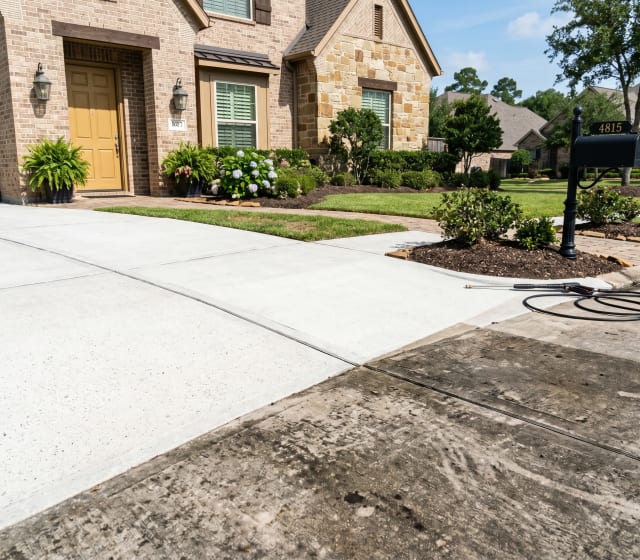 Driveway pressure-washed with crisp lines and clean finish — Katy, Houston