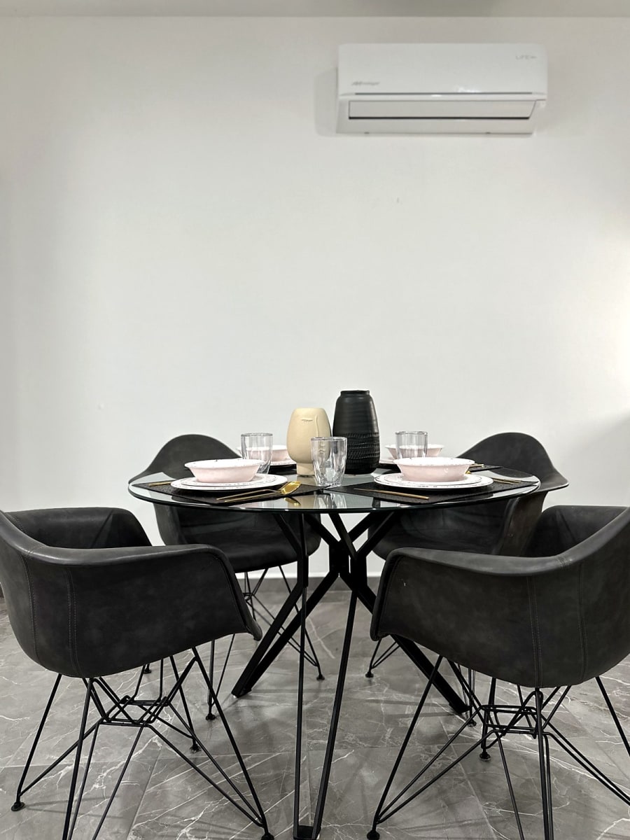 Round glass dining table for four