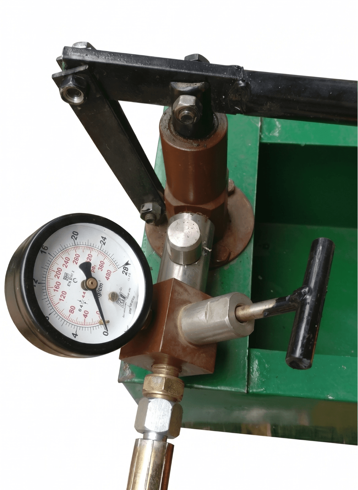 Close-up of the high-precision pressure gauge and manual control valve on the Mufaddal Enterprises hydraulic test pump sold by Hirani Marketing Combines.