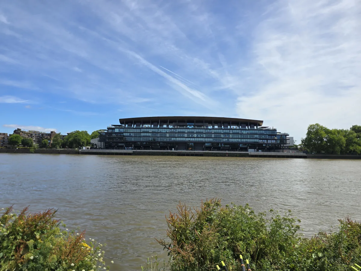 A modern glass and timber boathouse on the banks of the Thames