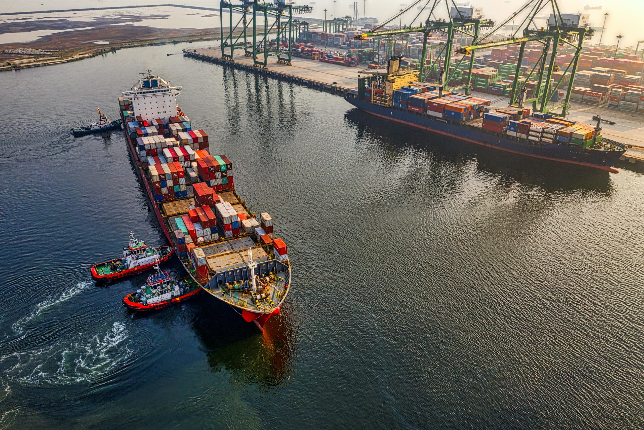 Shipping containers on a container ship leaving port
