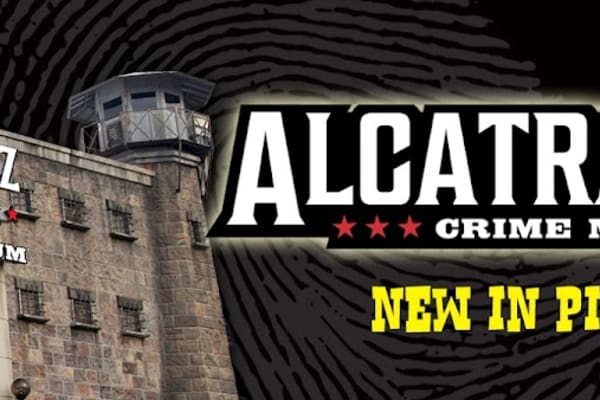 Crime museum exhibit with dramatic lighting