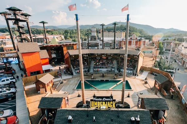 Lumberjack Feud outdoor arena with competitors in action