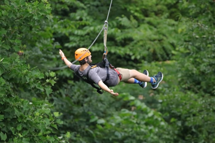 A rider on a Smoky Mountain zipline