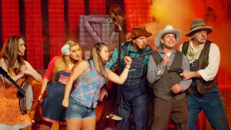 Performers on stage at the Hatfield & McCoy Dinner Feud