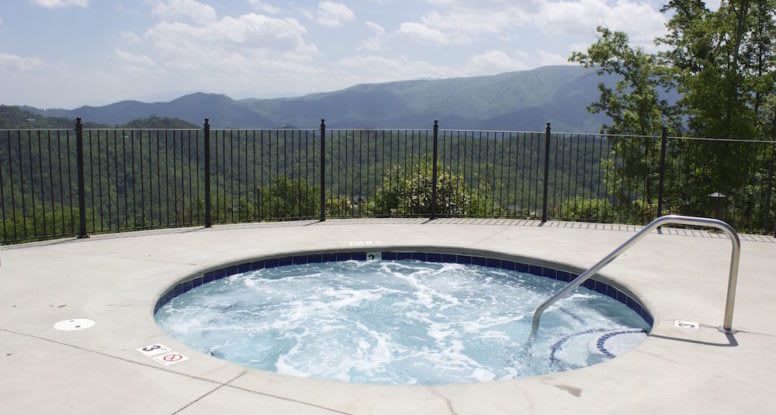 Hot tub on cabin deck at sunset
