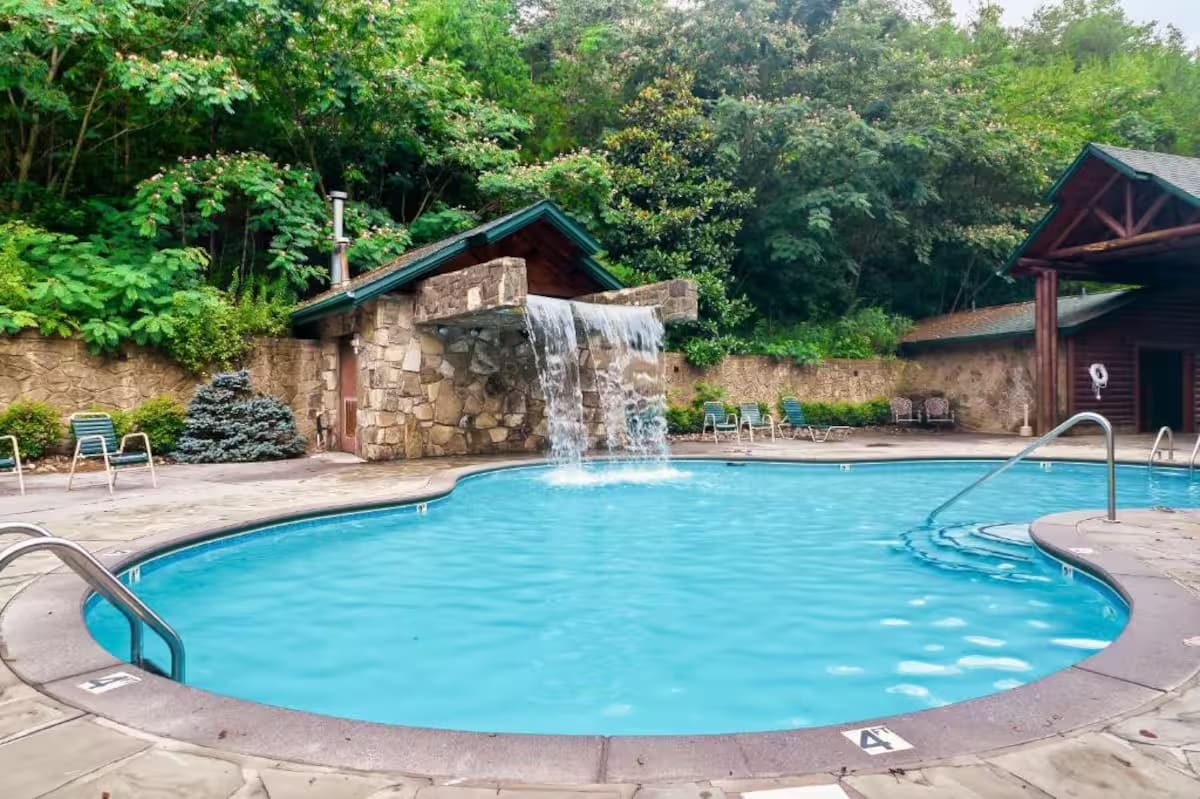 Gatlinburg Falls Resort pool area surrounded by cabin-style buildings