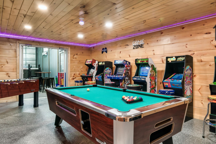 Game room with arcade games and pool table