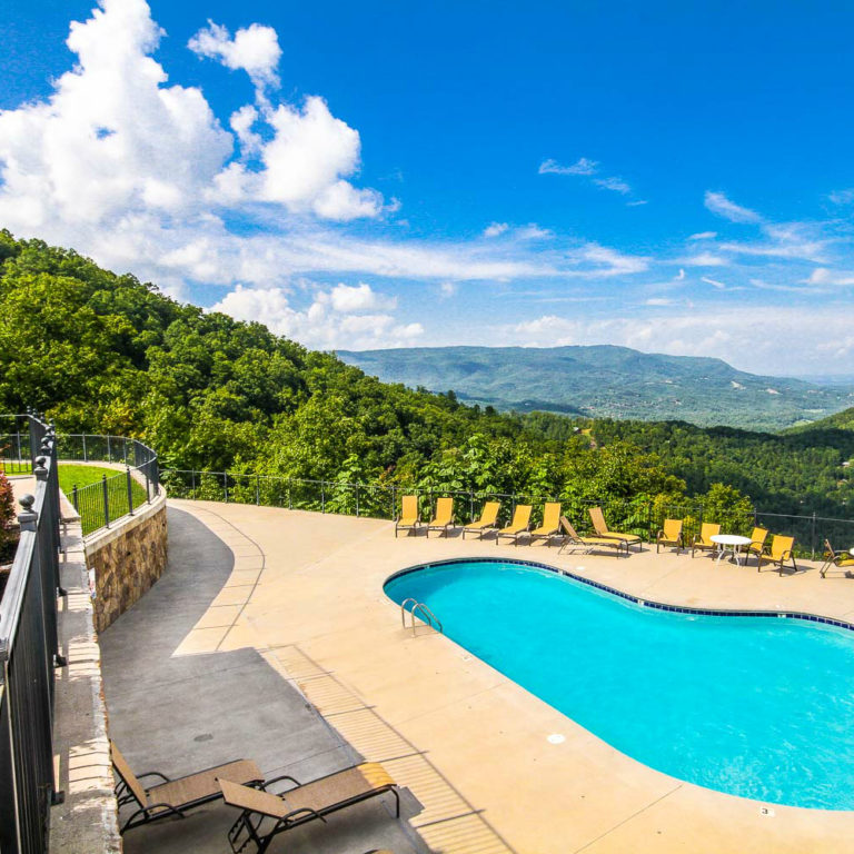 Resort pool surrounded by mountain views
