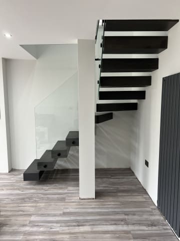 Cantilever · black treads — staircase or glass install by CAworks