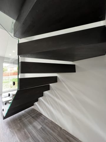 Tread detail · black steel — staircase or glass install by CAworks