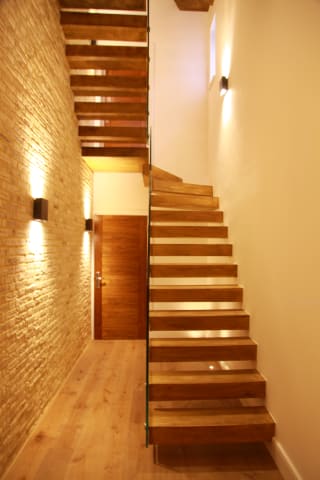 Floating · oak, wall wash light — staircase or glass install by CAworks