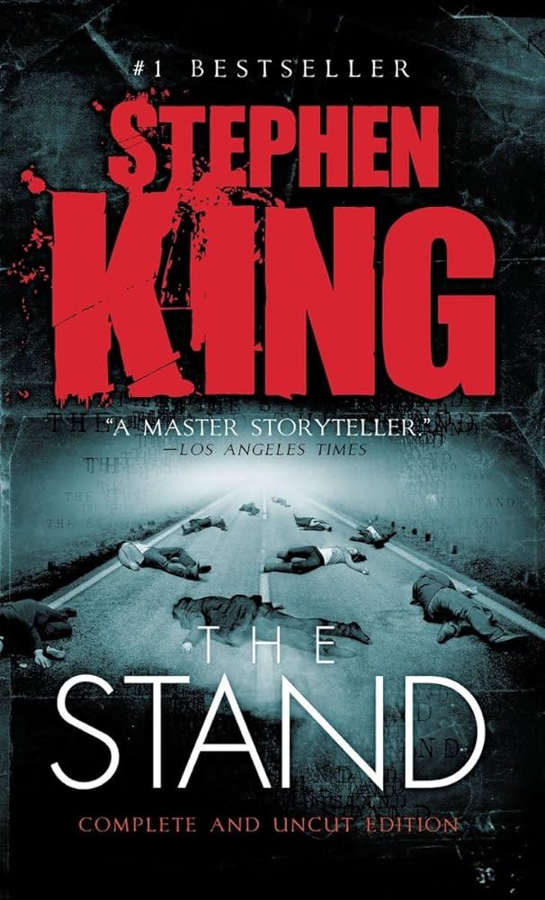The Stand book cover, text with title and author Stephen King, in background in a highway with bodies laying on it