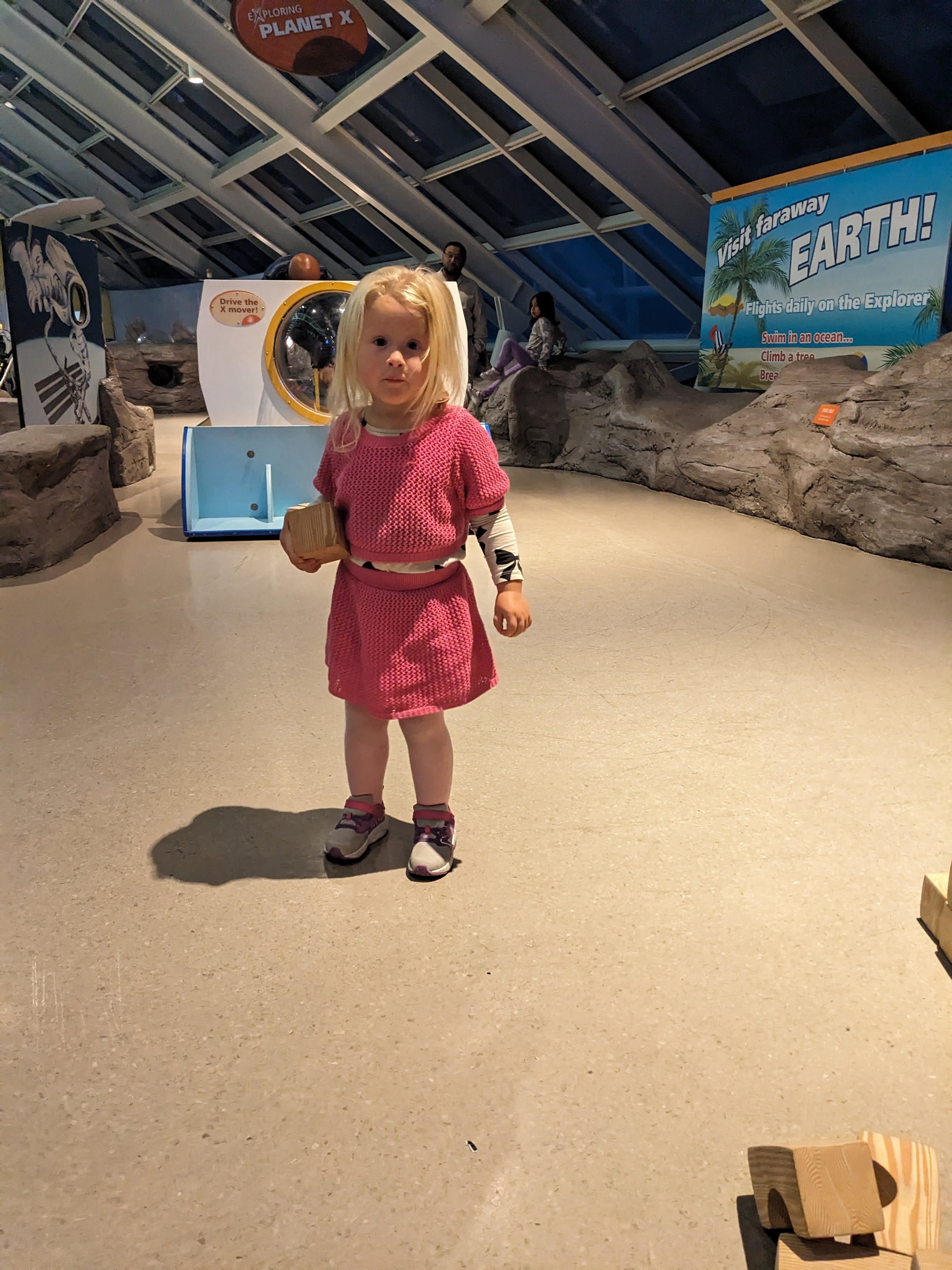 Kids playing in the Planet Explorers exhibit at Adler Planetarium