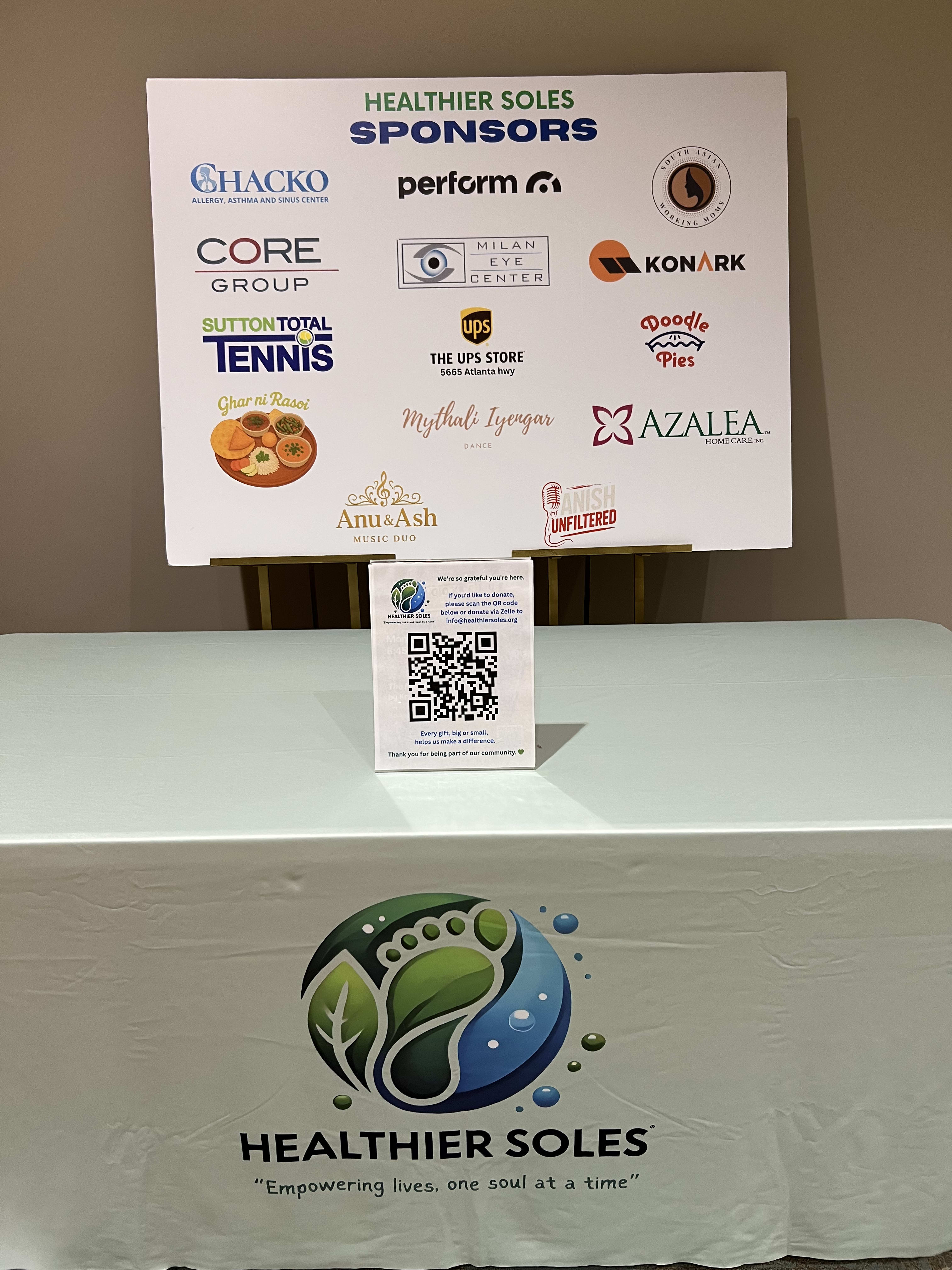 Healthier Soles team holding banner