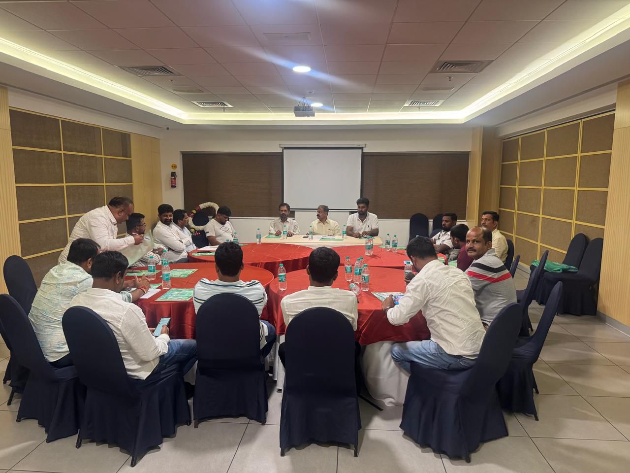 Management meeting with officials discussing sericulture planning