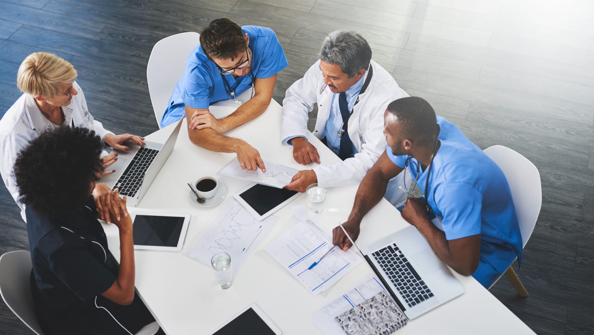 clinicians-and-administrators-collaborate-at-a-table