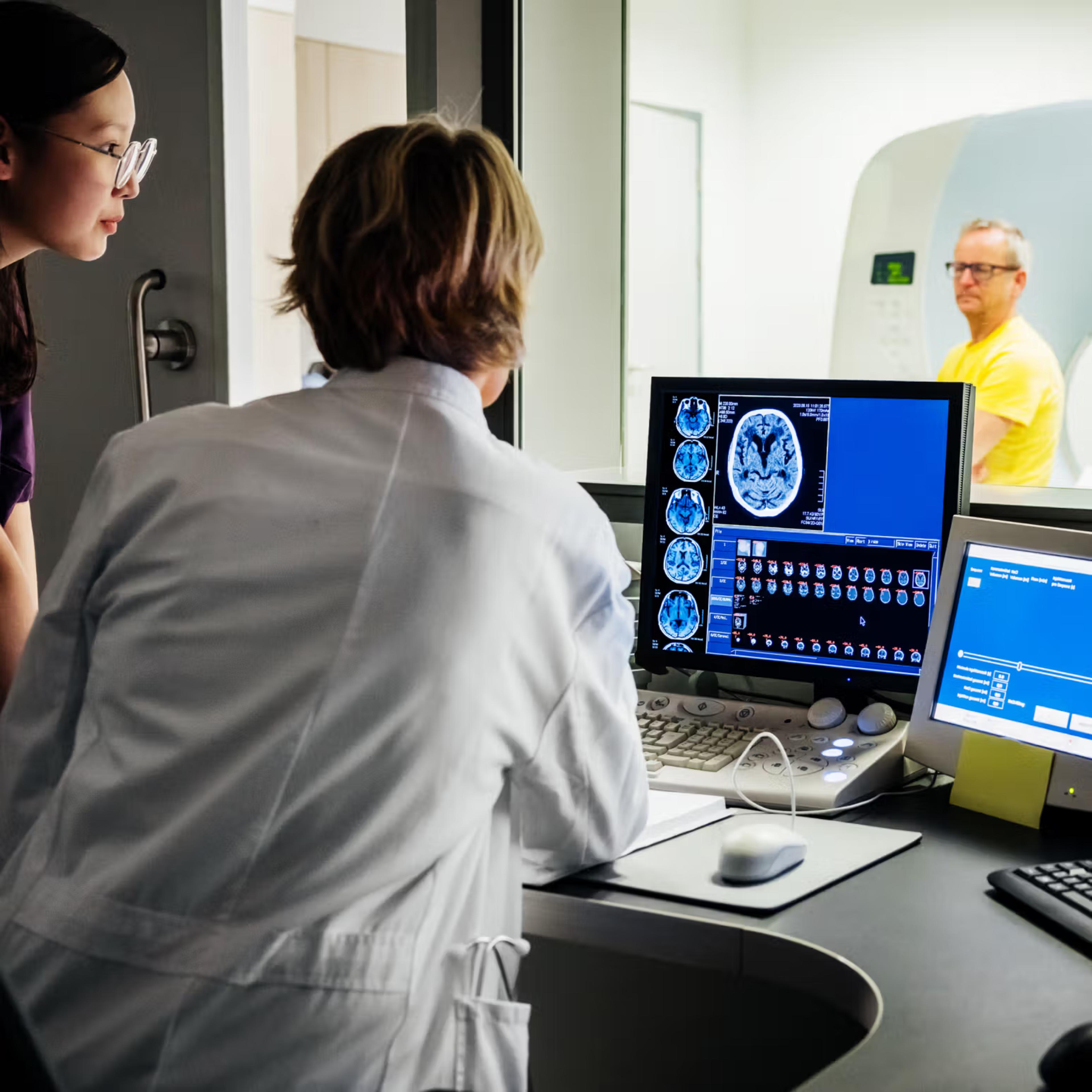 Medical professional reviewing radiology scan