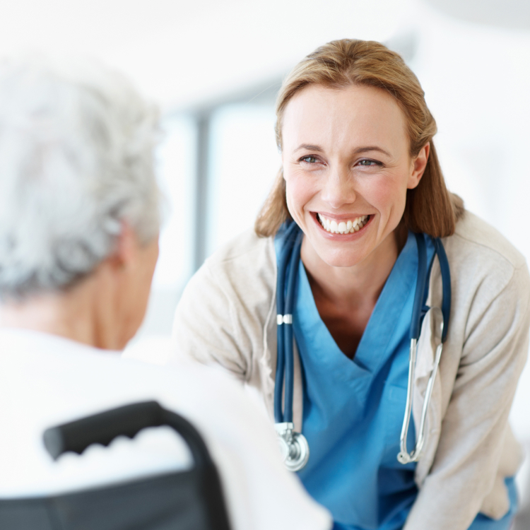 smiling doctor speaking with patient