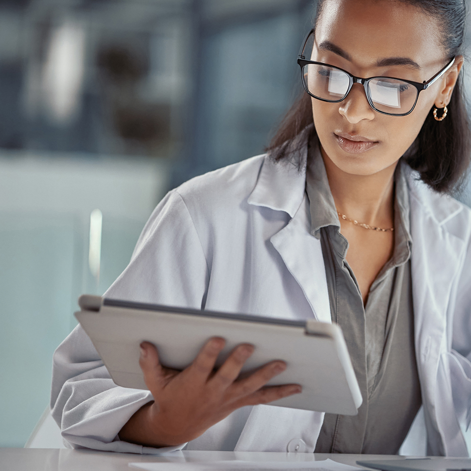 Doctor holding a tablet.