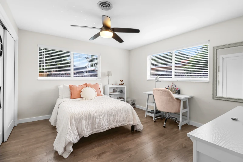 Bedroom with white integrated closet