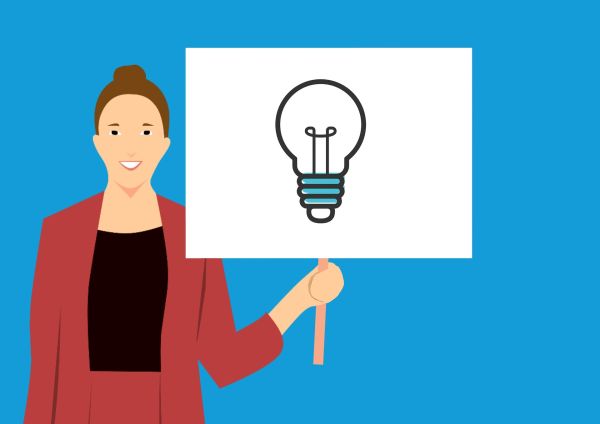 animated woman holding a sign with a light bulb on it