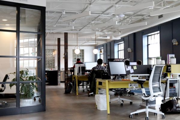 open office floorplan with employees working on computers