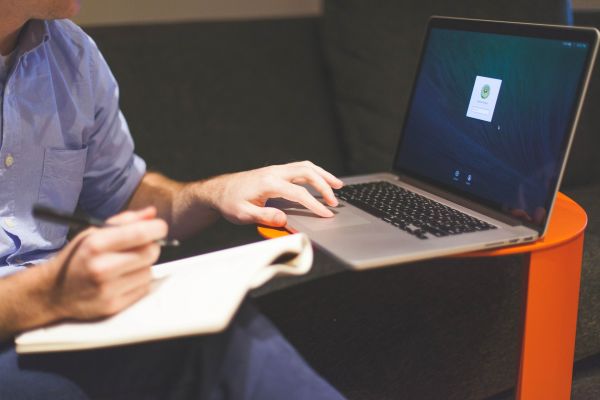 man at a table with laptop