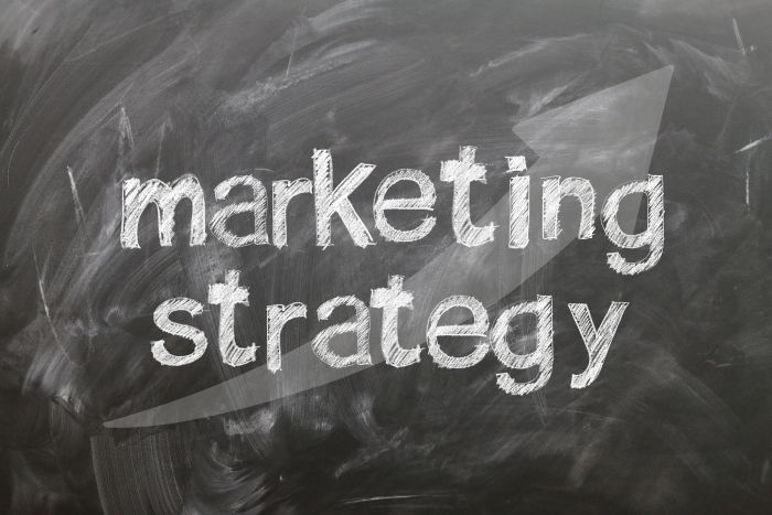 chalkboard writing that says 'marketing strategy'