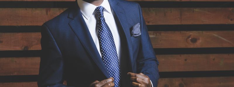 man in a blue suit looking sharp