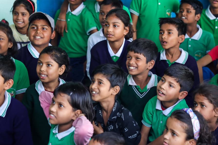 Schoolchildren smiling in class at the learning centre