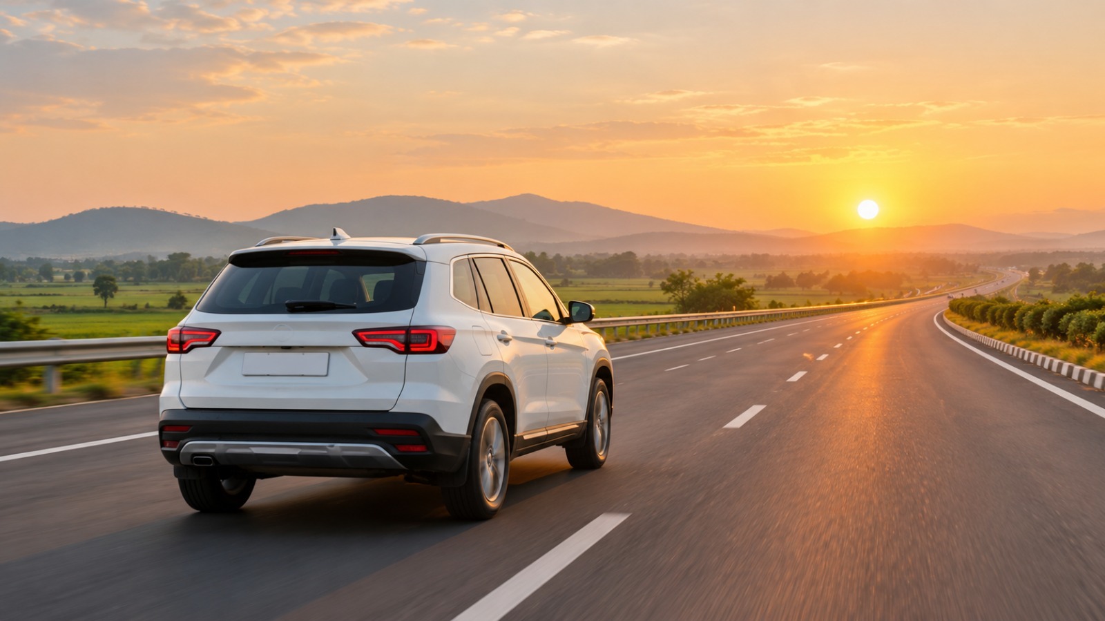 Self drive SUV on a Gurugram highway road trip at sunset