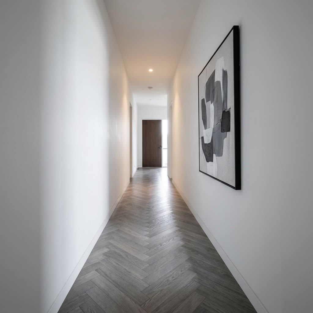 Minimalist Hallway with Grey Herringbone Laminate Finish
