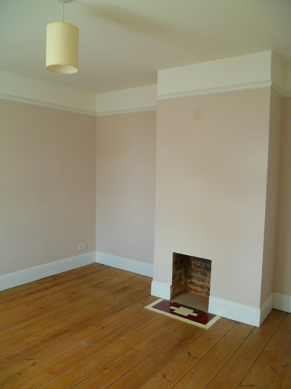 An image showing restoration work for the back bedroom including floor sanding and refinishing, plastering, and painting and decorating