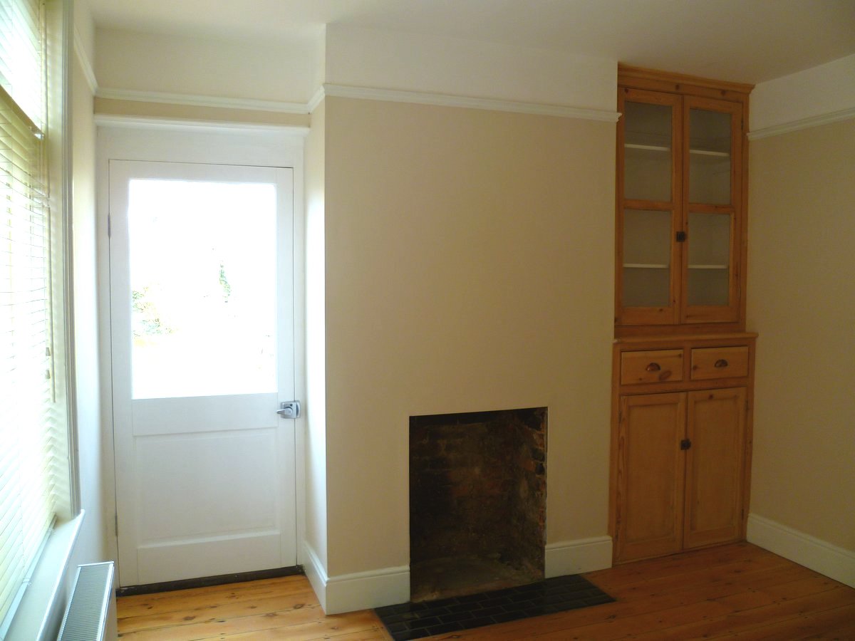 An image showing restoration work for the dining room including floor sanding and refinishing, plastering, and painting and decorating