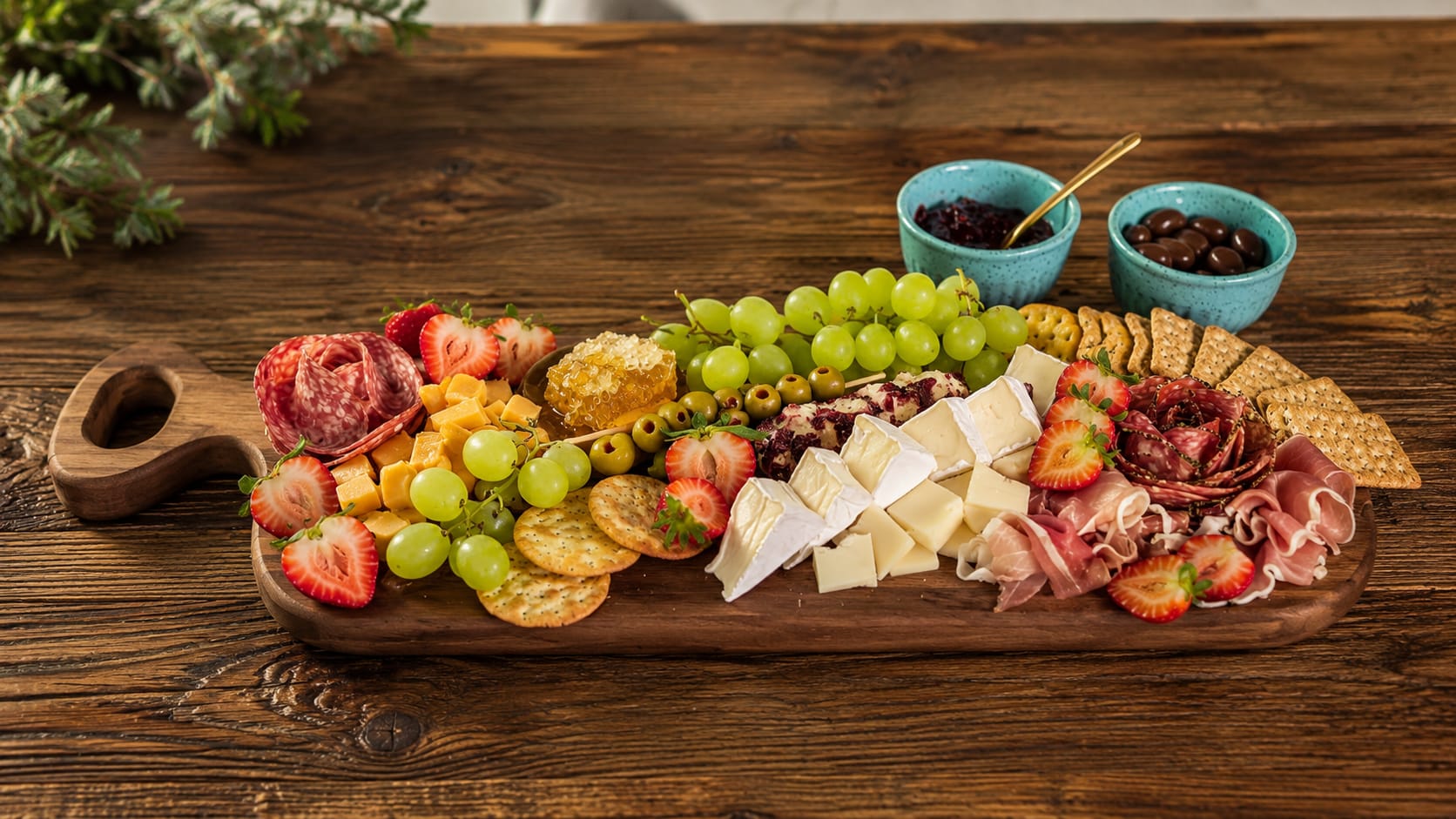 Charcuterie board with meats, cheeses, fruit and crackers