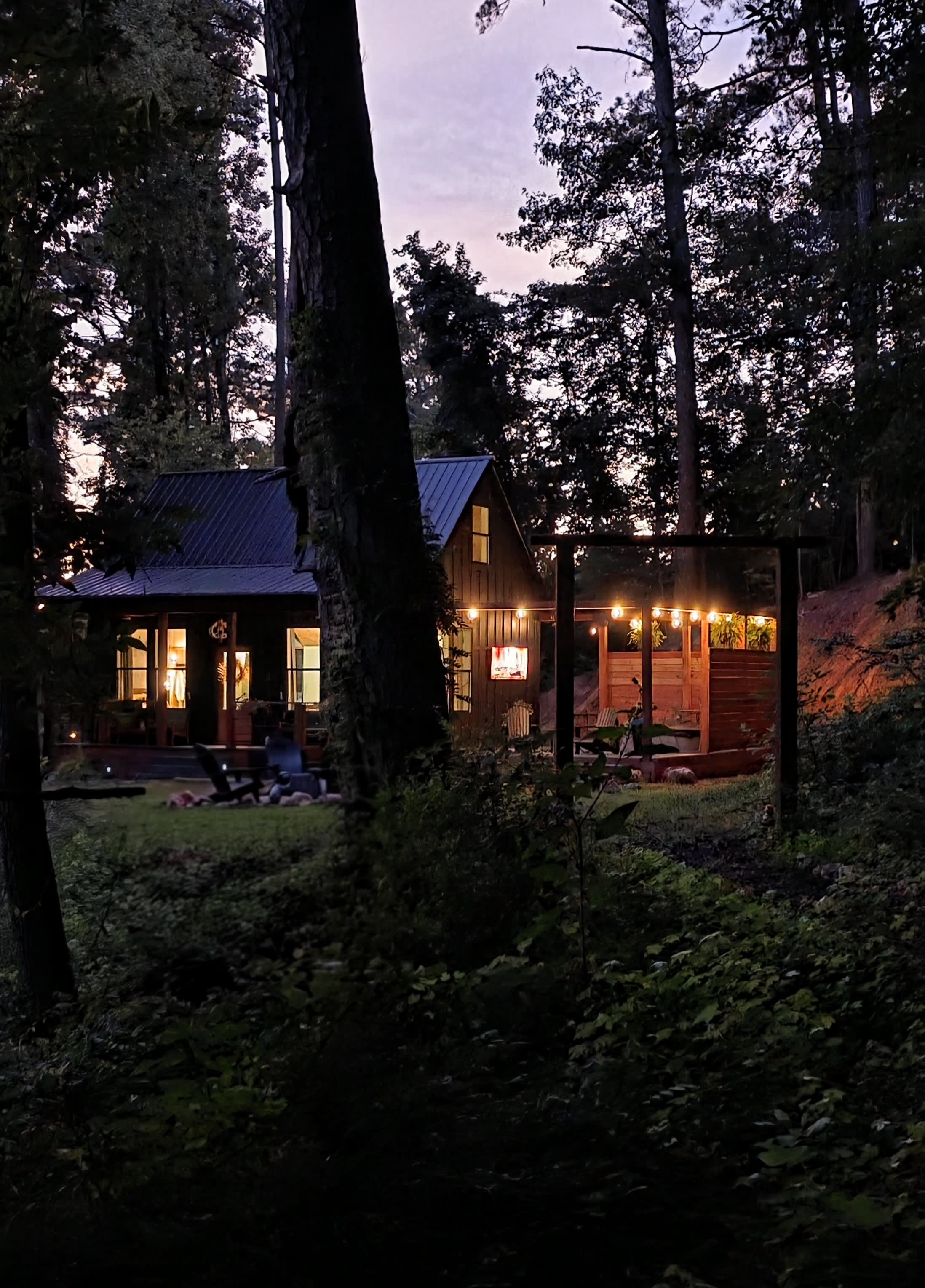 The cottage at night from the spring path