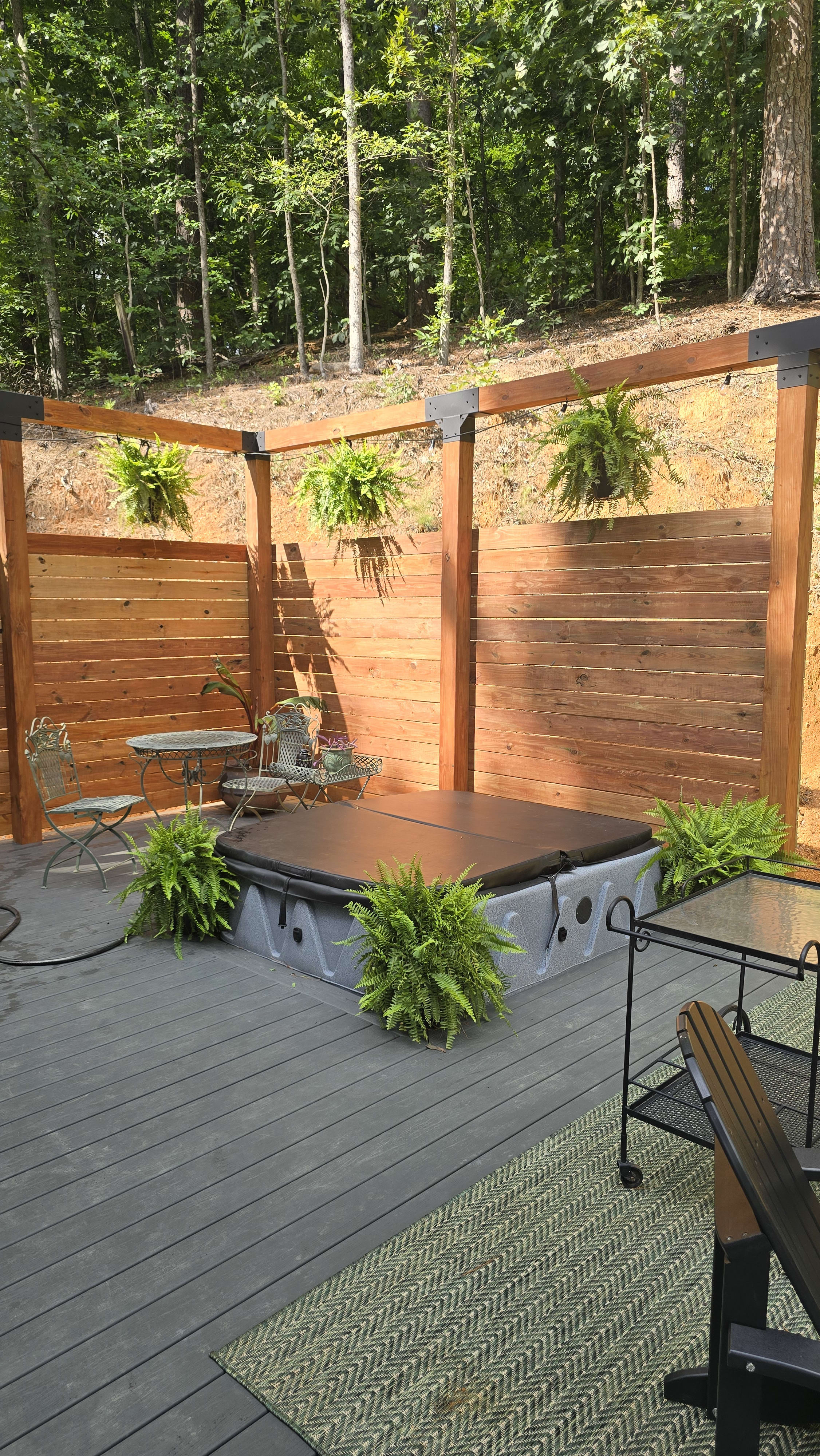The finished deck and hot tub at Hidden Springs