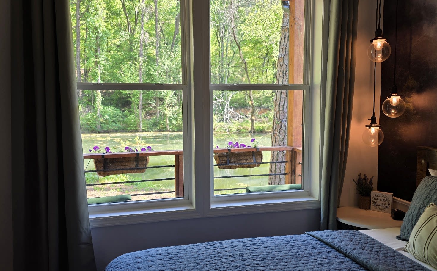 Bedroom 1 — Master Queen with woodland mural