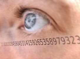 A close up of an open eye with numbers justaxposed onto it