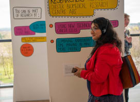 A woman listening to audio files as part of an art exhibition