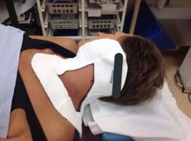 Jo Taylor with mask on to keep head still for radiotherapy.