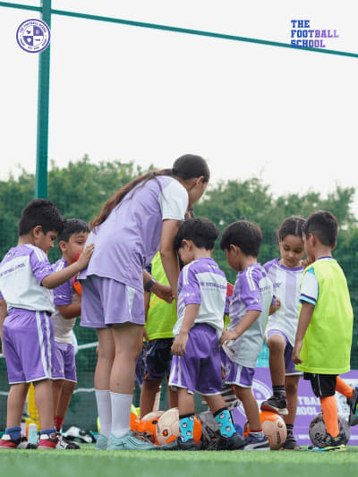 Kids passing drill at football coaching session Sector 49 Noida