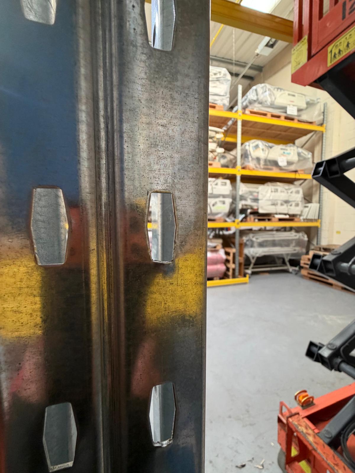 Rackstor installation engineer carrying out the pallet racking repair from a scissor lift