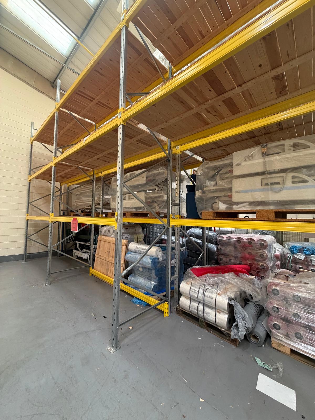 Close-up of the new replacement pallet racking upright showing the connector slots after installation