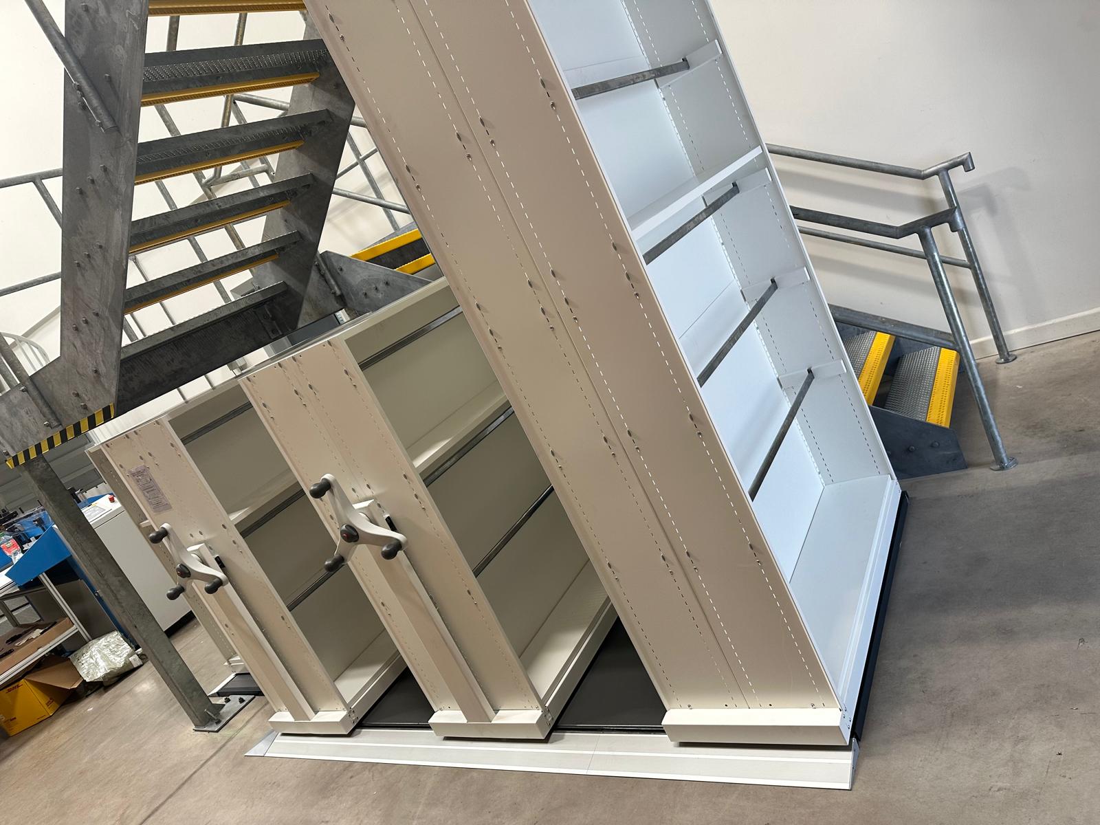 Mobile shelving installed beneath a staircase in Gloucestershire