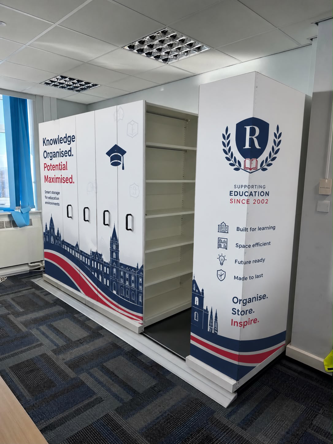 Rackstor Module R mobile shelving system installed on a floating shimmed steel track with raised melamine floor