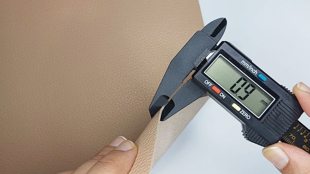 Step 1a: Measure the thickness of your leather Step 1a: I measure the thickness of the leather sample I'll be working through.