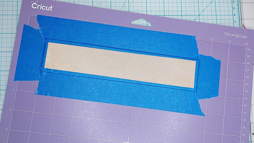 Step 6: Tape down the edges Step 6: I tape down the edges of the leather on all four sides.