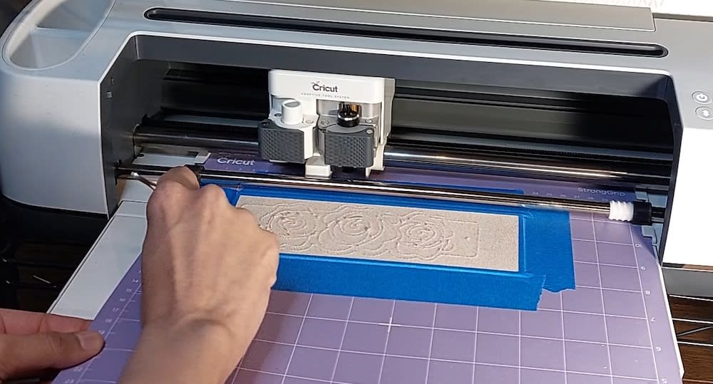 Step 4d: When complete, do a quick manual check Step 4d: I check the cut with a pair of tweezers without releasing the mat yet.